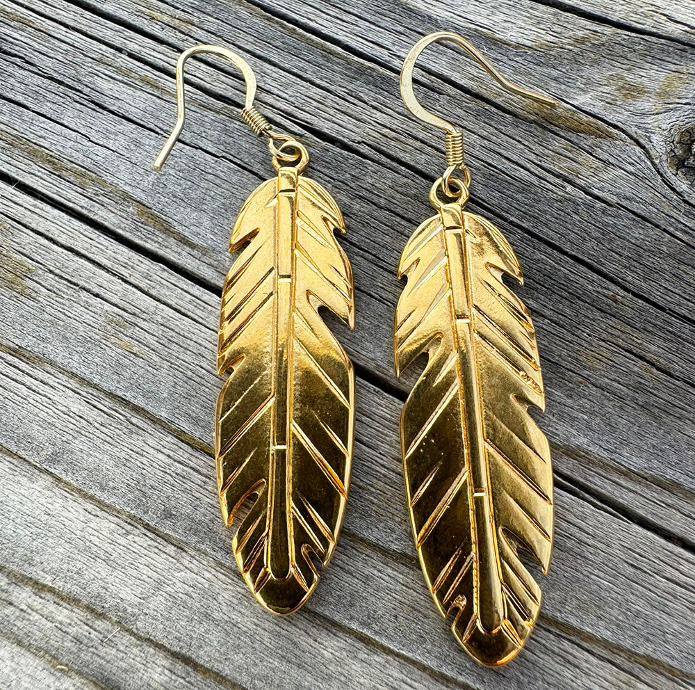 Long feather-style horsehair earrings with a golden wing accent