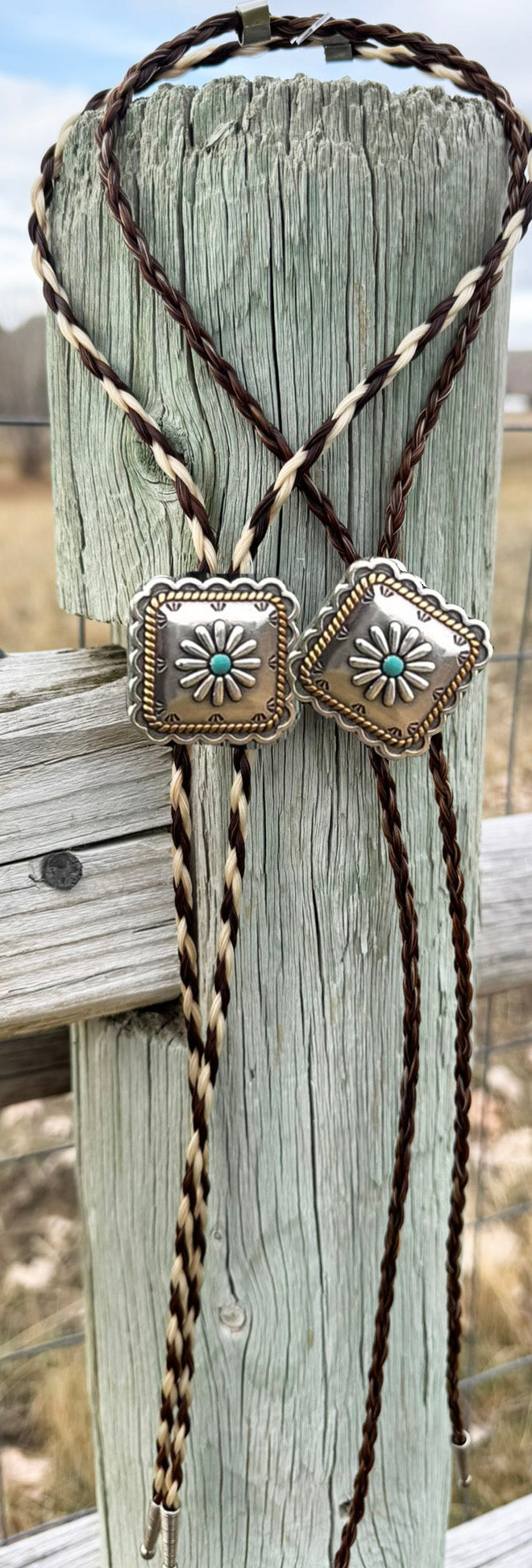 Bolo tie on a horsehair cord with a squared turquoise slide and silver tips