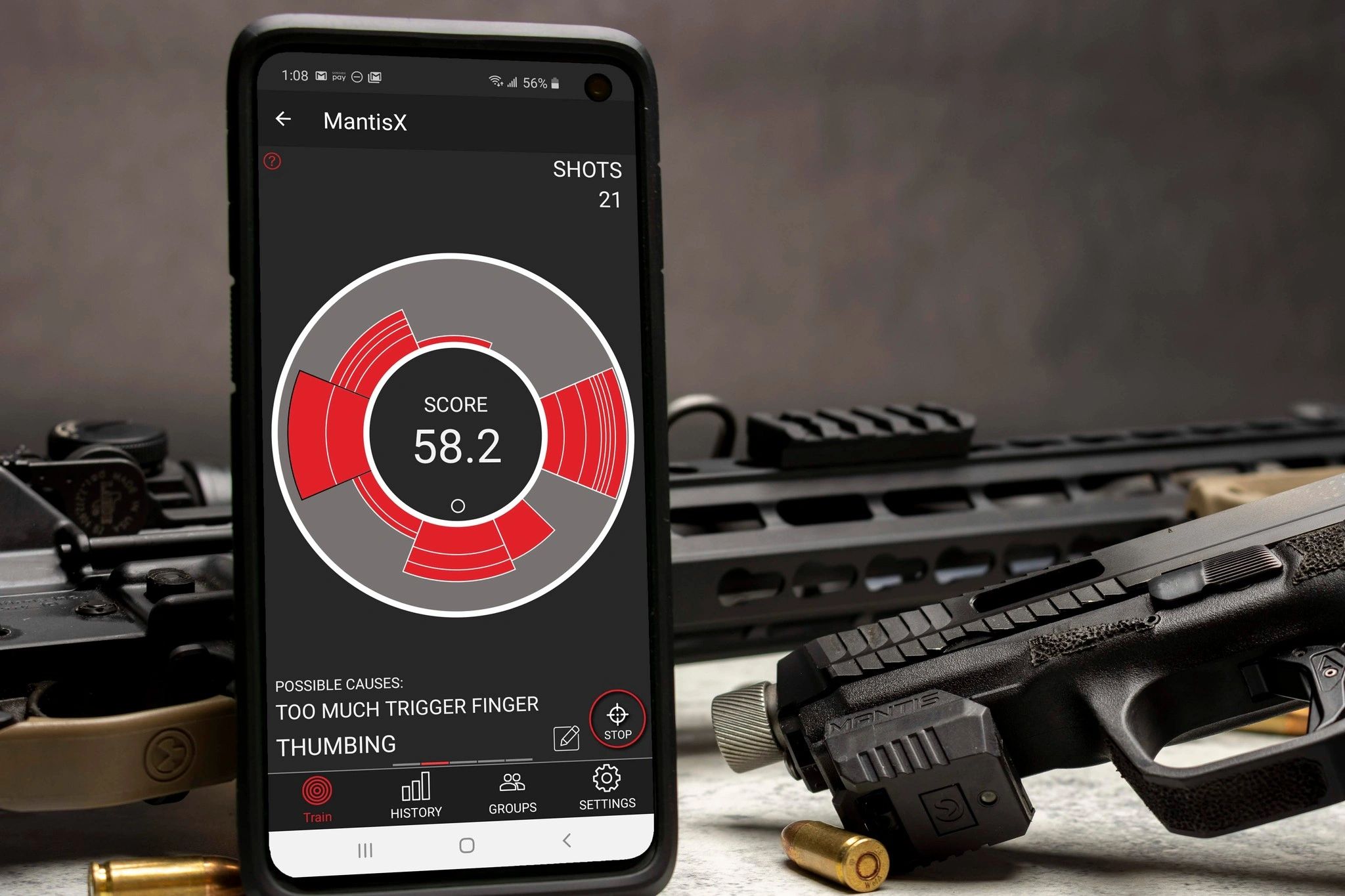 MantisX shot-analysis sensor mounted on a pistol rail with the Mantis training app