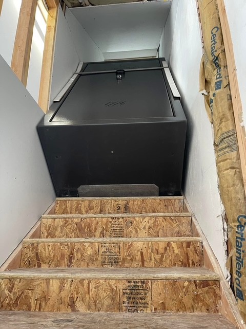 Liberty 1776 safe filling an unfinished stairwell.