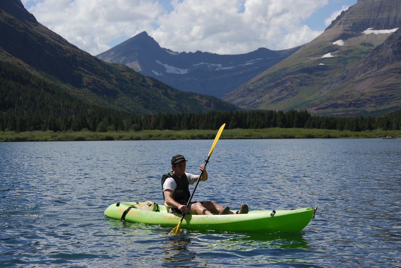 Kayaker paddling in Glacier National Park